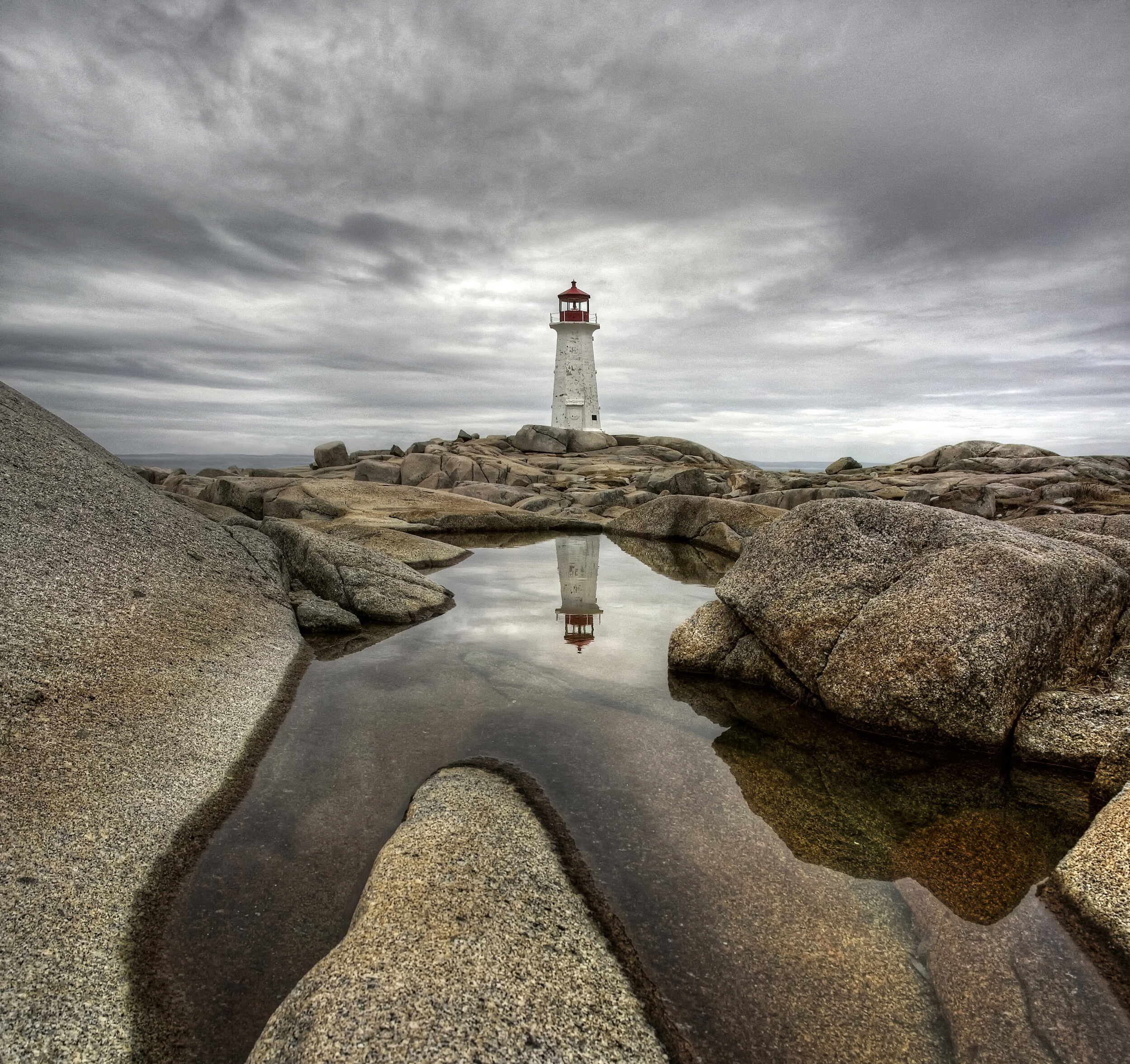 Moody Lighthouse Reflection